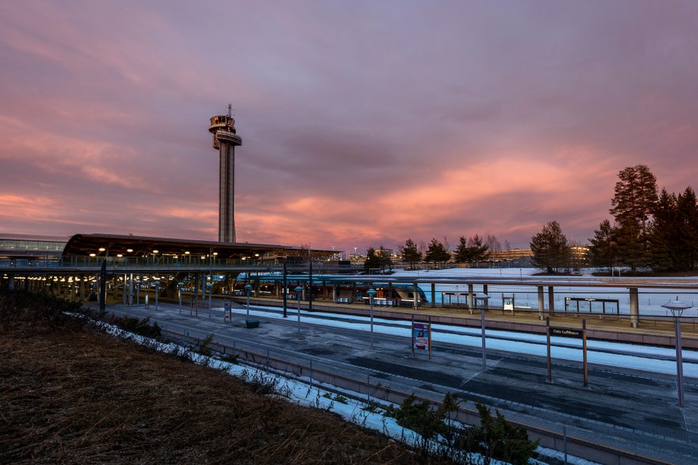 Terminal and control tower at Oslo Airport Gardermoen on a winter evening