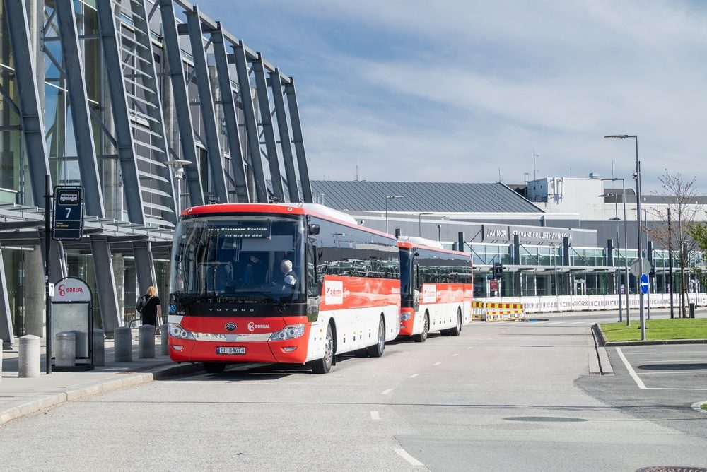 Airport buses at the bus stops outside the terminal at Stavanger Airport Sola